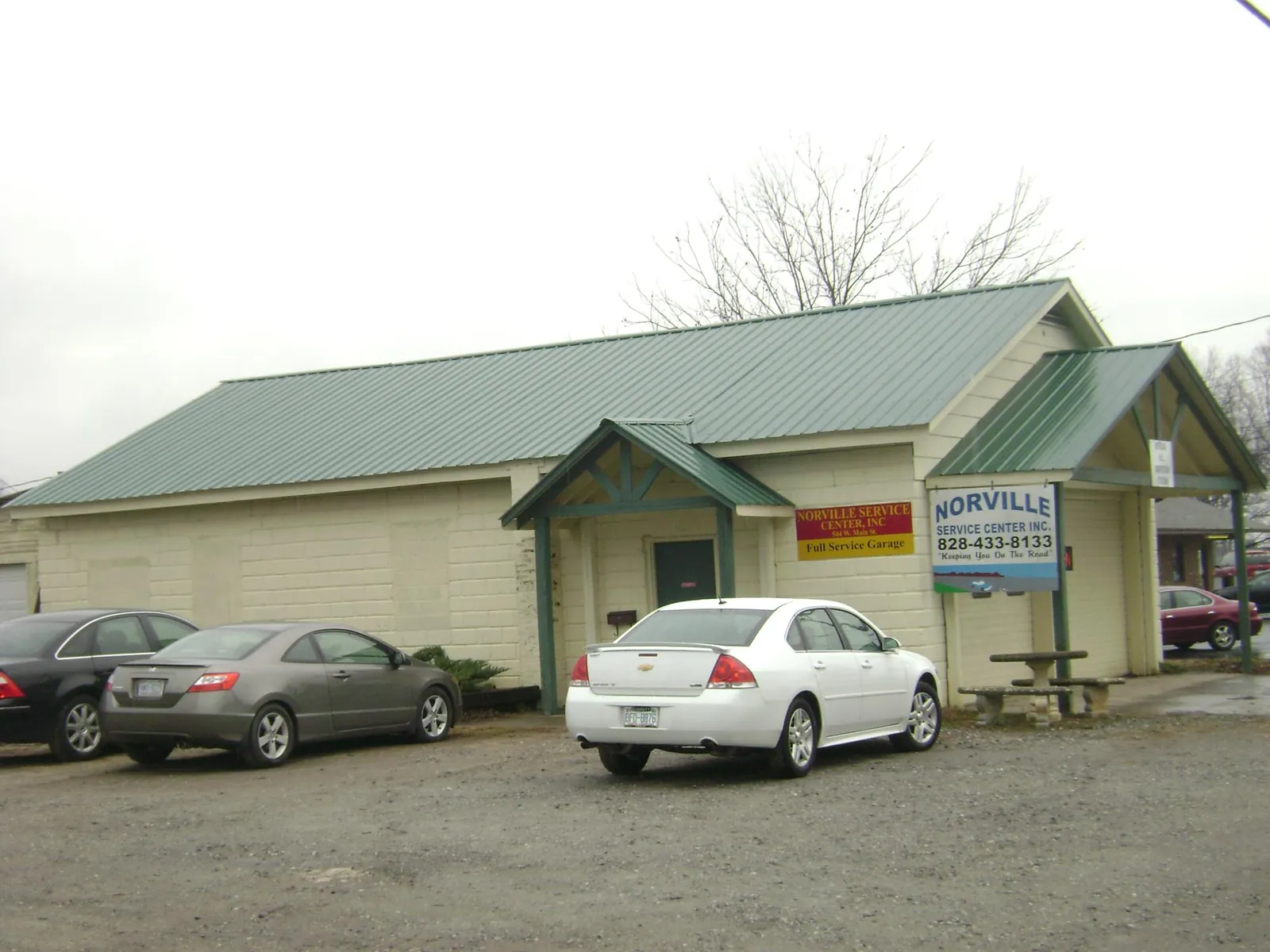 Green metal roof on a service garage with a covered entry in Rock Hall